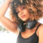Lila Iké Treasure Self Love Album Review - pic of beautiful woman wearing headphones.