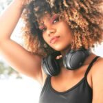Lila Iké Treasure Self Love Album Review - pic of beautiful woman wearing headphones.