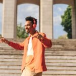 41 New Soca Songs That You Will Love pictured is a young man happily listening to music