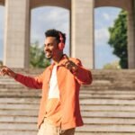 41 New Soca Songs That You Will Love pictured is a young man happily listening to music