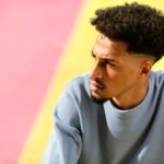 Caught In Between The Bacchanal & Bad Bunny Pictured Is A Young Man Deep In Thought