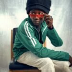 Why Keznamdi Bested Mortimer At The Grammys - Pictured Is A Rasta Man Wearing Sunglasses